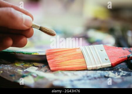 Painting artwork: paint brushes on painting background Stock Photo