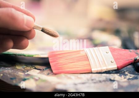 Painting artwork: paint brushes on painting background Stock Photo