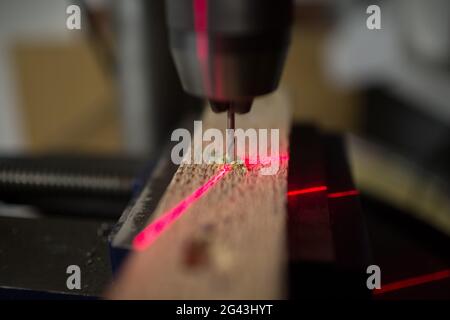 Drilling machine with laser sight in the workshop. Stock Photo