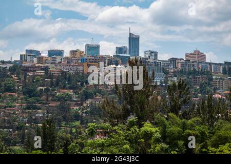 City skyline with trees in the foreground viewed from the gardens of the Kigali Genocide Memorial Center, Kigali, Kigali Province, Rwanda, Africa Stock Photo