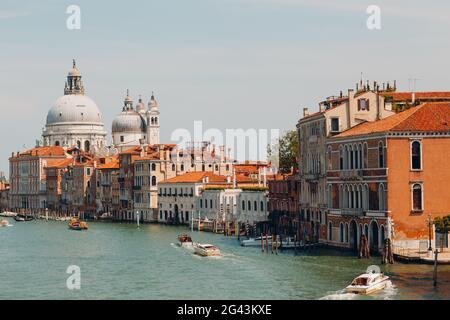 Old cathedral of Santa Maria della Salute and Grand Canal in Venice, Italy Stock Photo