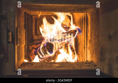Blaze fire flame in stove, orange and black Stock Photo