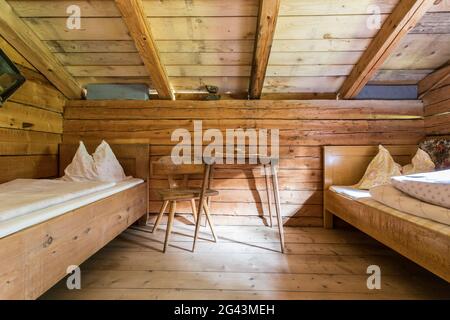 Holiday in the mountains: Rustic old wooden interior of a cabin or alpine hut Stock Photo