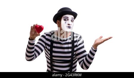 Mime holding red heart isolated on white background Stock Photo