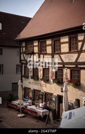 Guests sit in the outdoor area of the historic &quot;Scharfeck&quot; restaurant in Fridingen an der Donau, Baden-Württemberg, Germany Stock Photo
