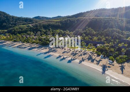 Aerial view of beach with shadows from coconut trees at Six Senses Fiji Resort, Malolo Island, Mamanuca Group, Fiji Islands, South Pacific Stock Photo