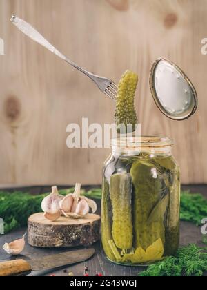 Pickled cucumbers on wooden background Pickled cucumbers on wooden background Stock Photo
