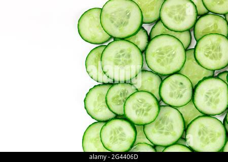 Cucumber slices, shot from the top on a white background Stock Photo