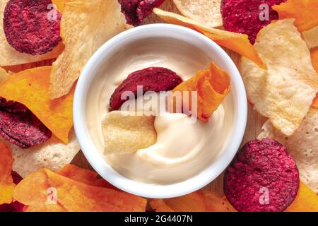 Vegetable chips with a dip close-up shot Stock Photo