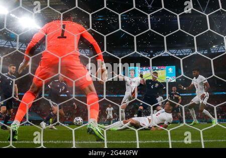 London, UK. 18th June, 2021. England's John Stones (below) competes during the Group D match between England and Scotland at the UEFA Euro 2020 in London, UK, June 18, 2021. Credit: Han Yan/Xinhua/Alamy Live News Stock Photo