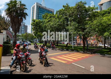 Motorcycle taxis wait for customers in the city center, Kigali, Kigali Province, Rwanda, Africa Stock Photo