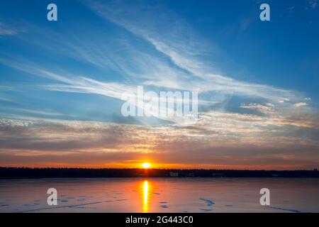Sunset over the winter lake Stock Photo