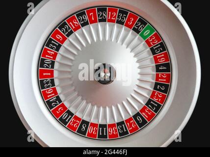 Casino roulette wheel isolated on Black background Stock Photo