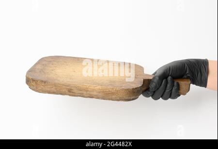 Woman holding very old empty brown rectangular wooden board in hand Stock Photo