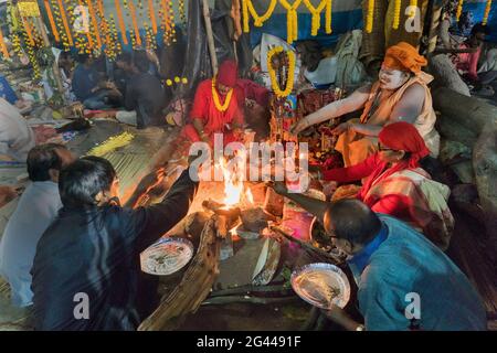 BABUGHAT, KOLKATA, WEST BENGAL / INDIA - 9TH JANUARY 2018 : Gathering of Indian Hindu Sadhus , singing religious prayers in front of holy fire. Stock Photo