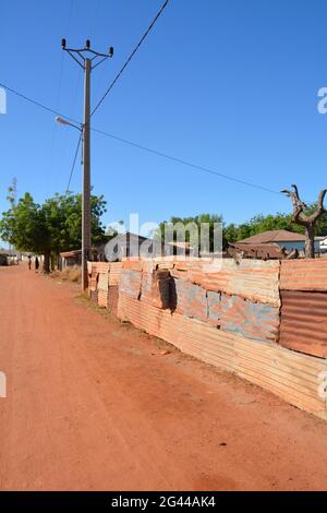 Gambia; Central River Region; Kuntaur; Main street at the entrance to the village; Rest in the midday heat Stock Photo