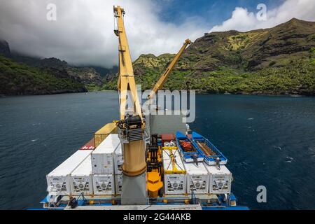 View over the cargo deck with cargo cranes on board the passenger cargo ship Aranui 5 (Aranui Cruises), Hanavave, Fatu Hiva, Marquesas Islands, French Stock Photo