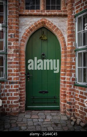 Old green door in Lueneburg, Germany Stock Photo