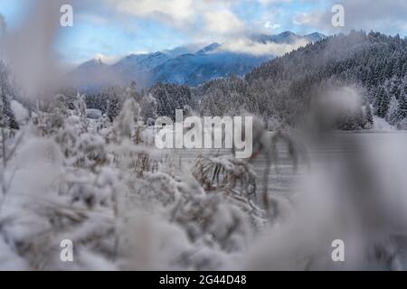 View through the clouds to the Sojerngruppe with Schöttelkarspitze and Sojernspitze, Krün, Mittenwald, Bavaria, Germany. Stock Photo