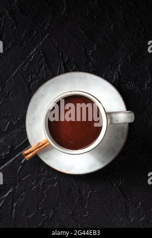 Hot chocolate in a cup, shot from above on a black background Stock Photo