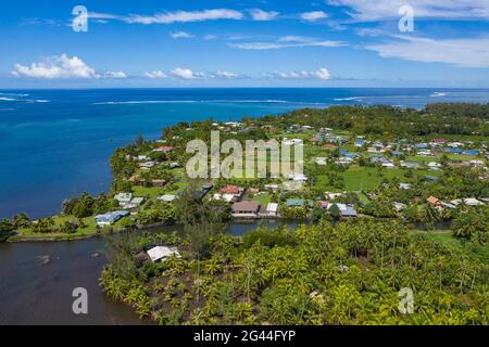 Aerial view of coastline with residential houses, Vaiperetai, Tahiti, Windward Islands, French Polynesia, South Pacific Stock Photo