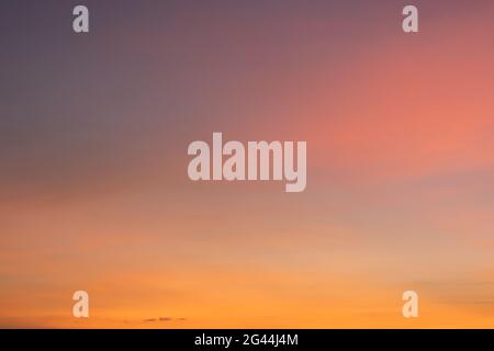 Twilight sky. Natural sunset or sunrise sky in orange, nature background. Stock Photo