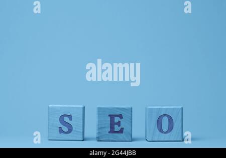 SEO inscription (search engine optimization) on wooden cubes. Stock Photo