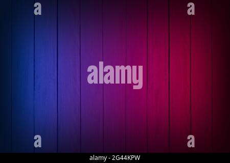 Neon light on wood wall texture background. Lighting effect red and blue neon backgrounds. Stock Photo