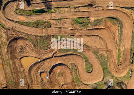 Overhead aerial view of the Cal Teuler motocross circuit, with the curves of the tracks (Bages, Barcelona, Catalonia, Spain) Stock Photo