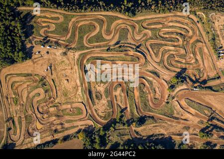 Overhead aerial view of the Cal Teuler motocross circuit, with the curves of the tracks (Bages, Barcelona, Catalonia, Spain) Stock Photo