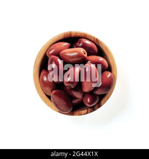 Red kalamata olives in wood bowl isolated on white Stock Photo