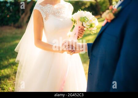 The newlyweds exchange rings at a wedding Stock Photo