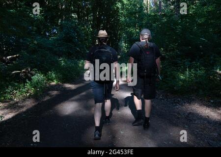 Berlin, Germany. 14th June, 2021. Two men hike through a forest in Grünau. (to dpa: 'Lonely times over: Corona trend hiking becomes more sociable') Credit: Paul Zinken/dpa-Zentralbild/dpa/Alamy Live News Stock Photo