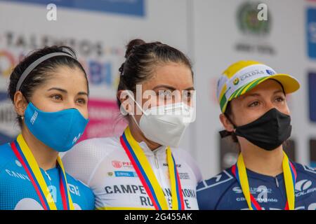 Pereira, Colombia. 18th June, 2021. Cyclists Yeni Lorena Colmenares, Paula Andrea Patiño and Diana Carolina Peñuela at the award ceremony of the of the Women's Colombian National Road Race Championship in Pereira, Colombia on June 18, 2021. Credit: Long Visual Press/Alamy Live News Stock Photo