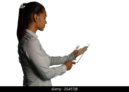 Businesswoman holding a transparent portable device Stock Photo