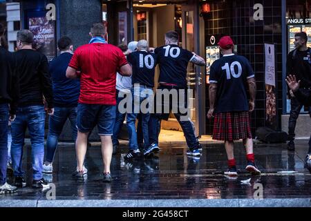 London, UK. 18th June, 2021. English and Scottish fans clash in Leicester Square, Central London ahead of the EURO21 match against England. Credit: Jeff Gilbert/Alamy Live News Stock Photo