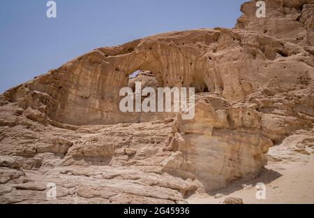 The famous arch shaped rock in the Timna valley park, the Negev desert, southern Israel. Stock Photo