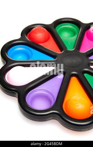 Colorful pop-push bubble sensory antistress toys in the shape of flower, isolated on white background. Close up Stock Photo