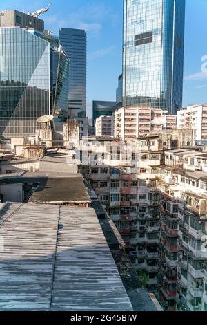 The popular between tourists place called Montane Mansion near to Tai Koo in Hong Kong. Overcrowded old retro building Stock Photo