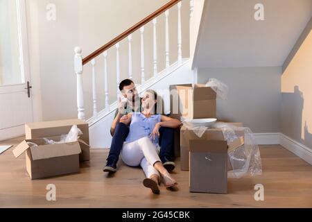 Caucasian couple arriving at their new home Stock Photo