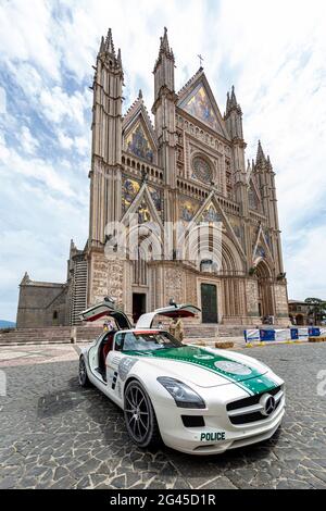 Mercedes SLS Coupe belonging to the Dubai police force parked in front of the Oriveto Cathedral in Umbria during the Mille miglia car rally 2021 Stock Photo