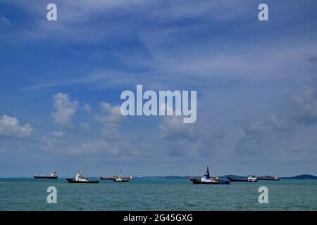 Tugboat sailing in the sea. Tugboat making maneuvers, Tanjung Pinang Riau Islands Stock Photo