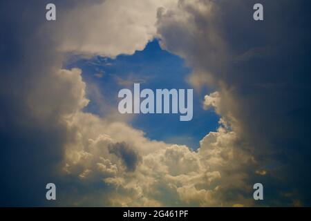 Blue hole in the clouds Stock Photo