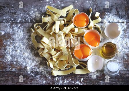 Raw noodles, eggs, flour. Egg noodles. Stock Photo