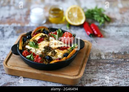 Feta cheese baked with vegetables. Keto diet. Healthly food. Stock Photo