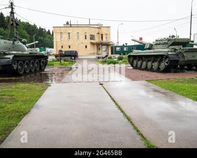 Sholohovo, Moscow Region, Russia - June 8, 2021: tanks and building of Museum of History of the T-34 Tank in rain. The founder of the museum is Vasili Stock Photo
