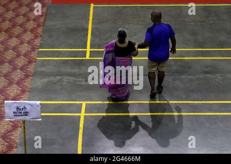 Chennai, Tamil Nadu, India. 19th June, 2021. An old woman walks with her son to get vaccinated with the Covishield, a COVID-19 vaccine at a vaccination camp in school premises in Chennai. Credit: Sri Loganathan/ZUMA Wire/Alamy Live News Stock Photo