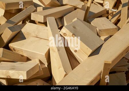 Remains of building material made of wood on the storage yard for processing in a pellet plant in the north of the city of Magdeburg in Germany Stock Photo
