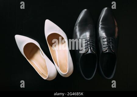 Shoes of the bride and groom. Stock Photo