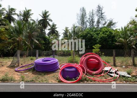 Tamil Nadu, India - June 2021: HT cables left by the road Stock Photo